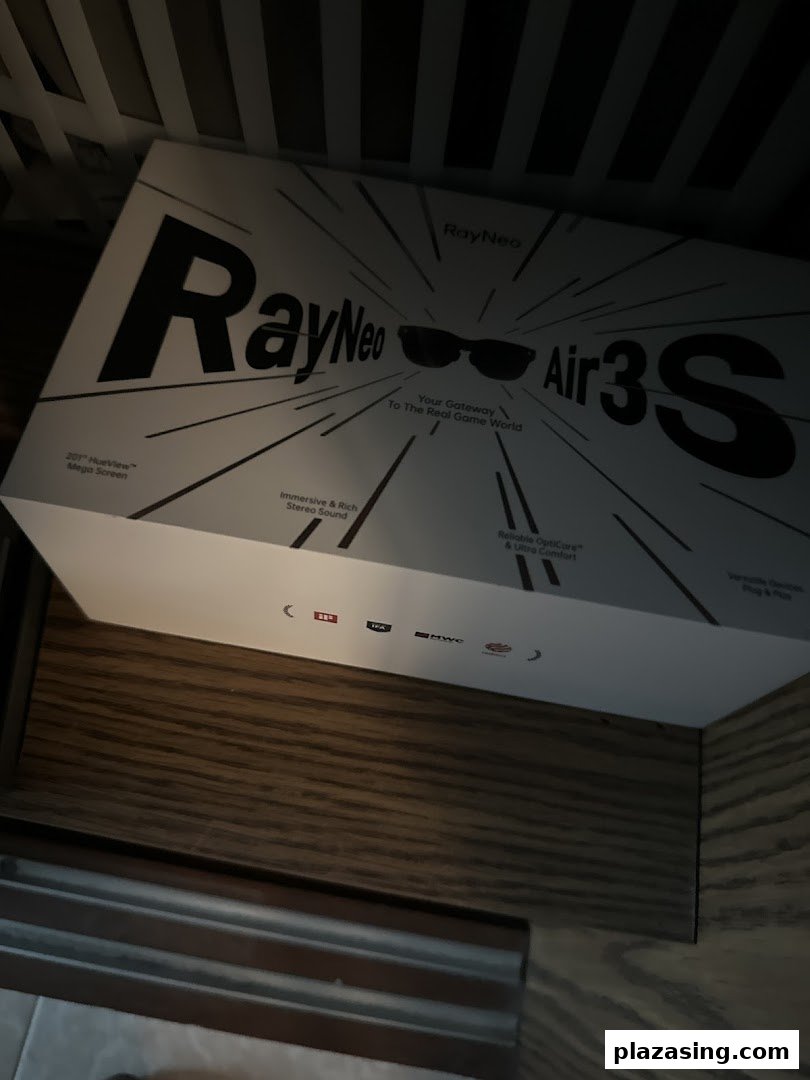 A RayNeo Air3S smart glasses product box displayed on a wooden shelf inside the optometrist shop.