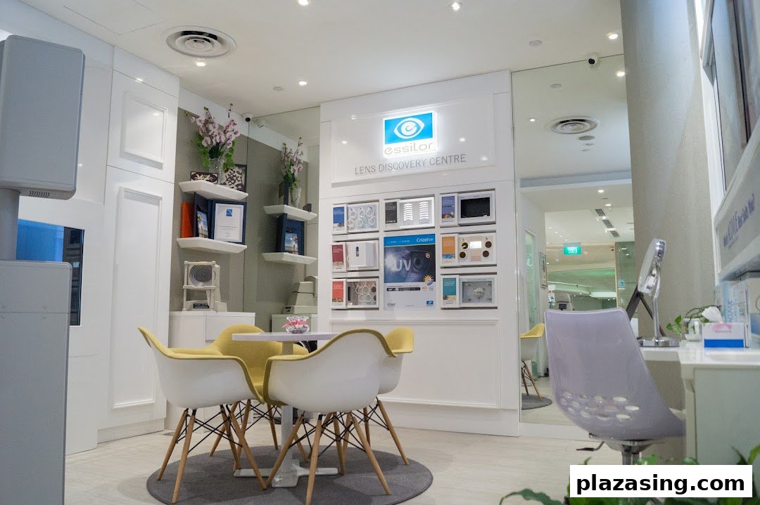 A bright, modern interior of an optometrist shop featuring a lens display and comfortable seating.