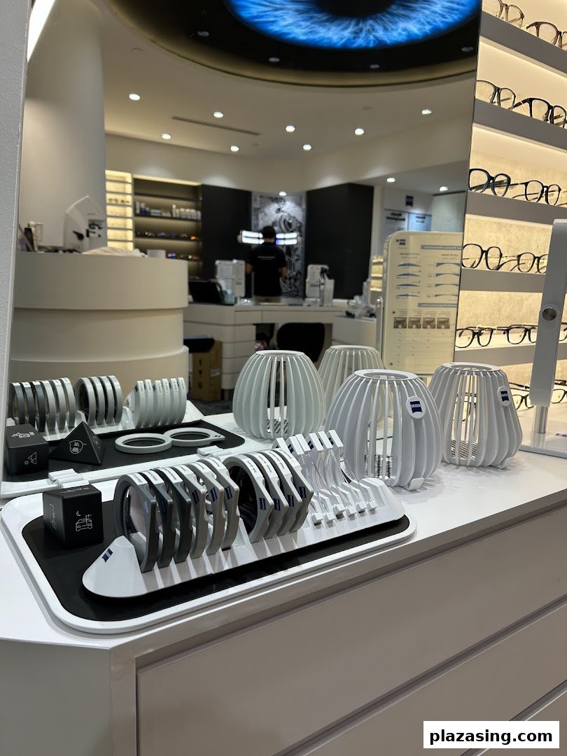 Interior view of ZEISS VISION CENTER, showcasing advanced optical display tools and stylish eyewear in a modern setting.