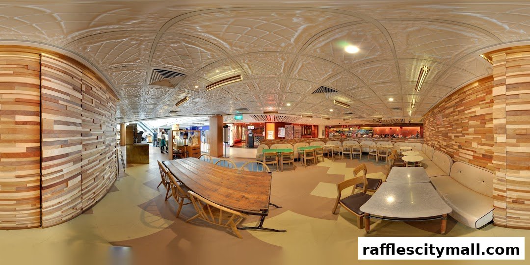 Interior view of Tiong Bahru Bakery with wooden walls, seating areas, and tables.
