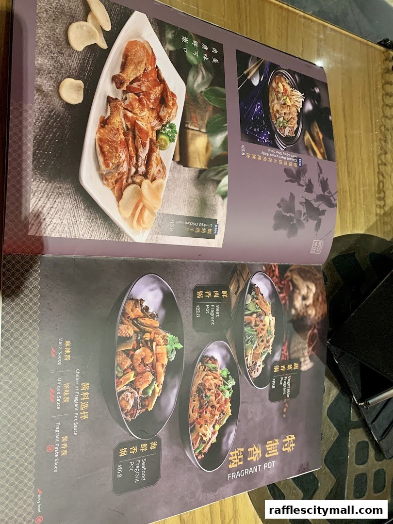 A menu featuring various fragrant pot dishes and smoked chicken with prices.