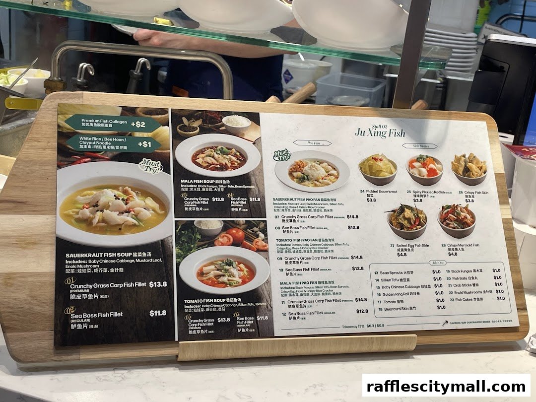 A menu board displaying various fish soup and pao fan dishes with prices and ingredients.
