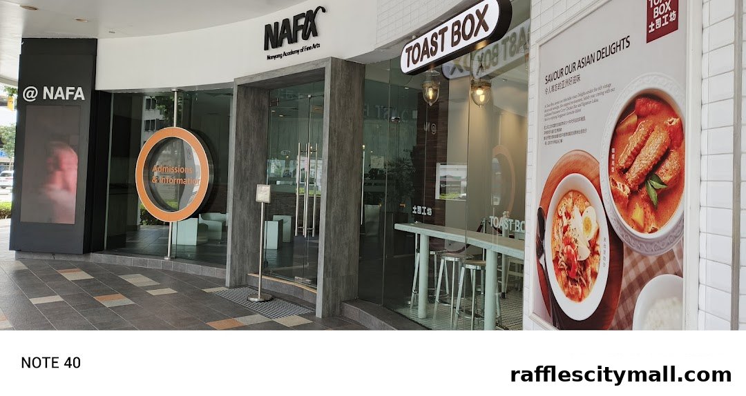 The exterior of Toast Box Raffles City, showcasing its entrance and a promotional poster of Asian dishes.
