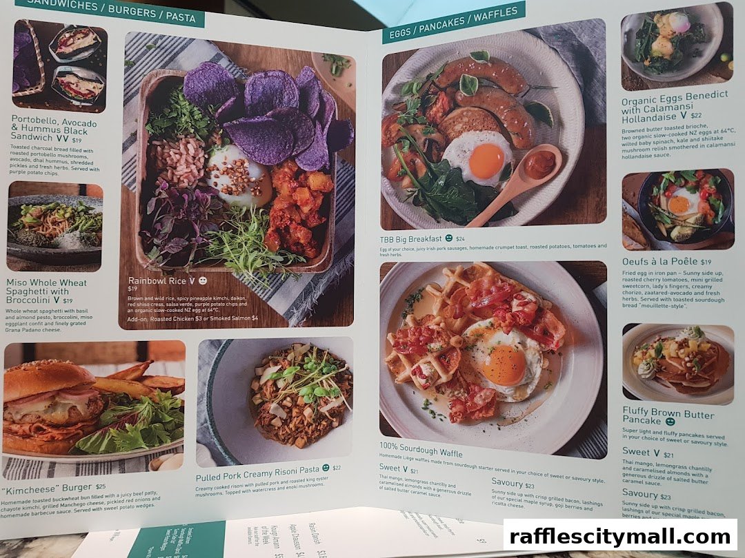 A menu from Tiong Bahru Bakery showcasing various breakfast and lunch dishes with appealing food photography.