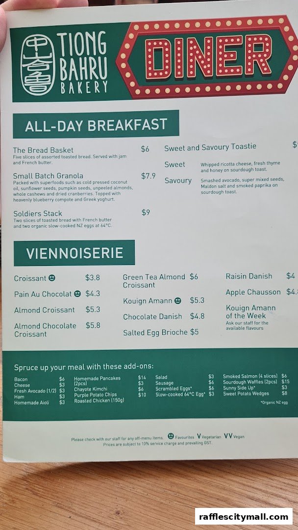 A menu from Tiong Bahru Bakery featuring breakfast items and viennoiseries.