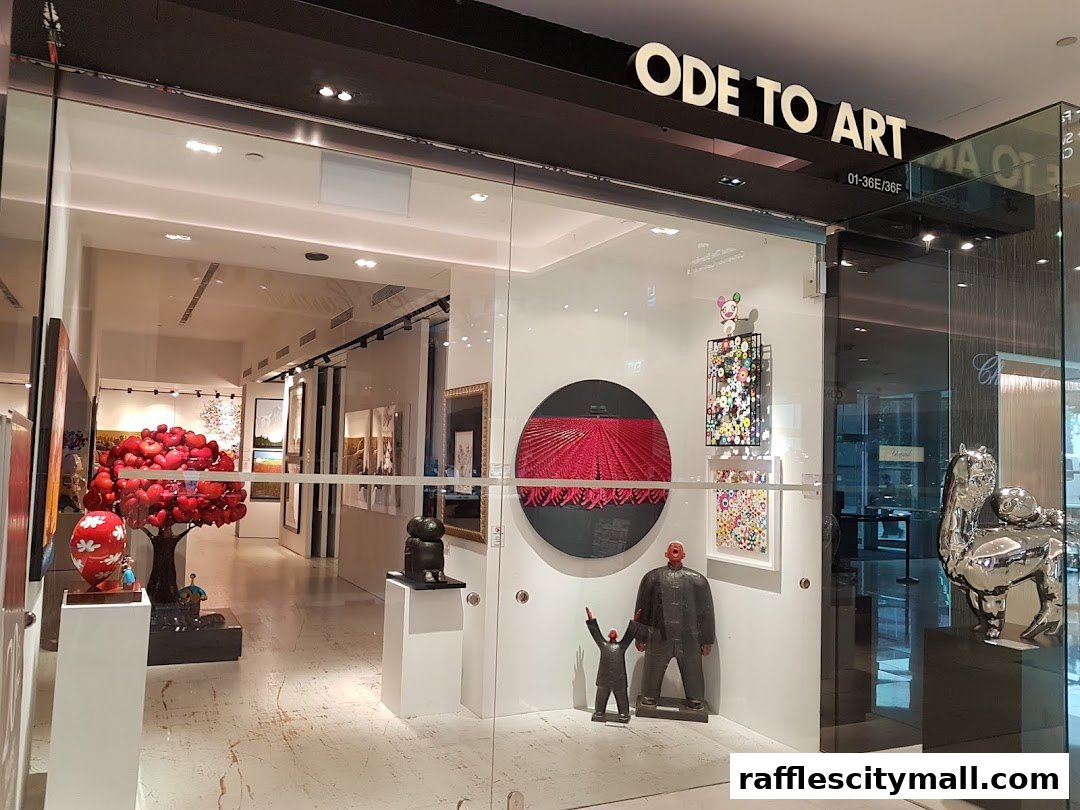 The entrance of an art gallery showcasing various sculptures and paintings.