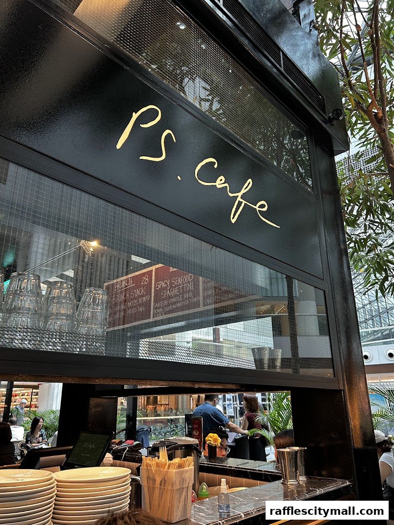 The stylish interior of PS.Cafe Raffles City with a view of the counter and menu.