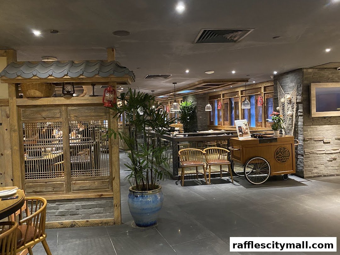 Interior view of a restaurant with traditional wooden decor and seating.