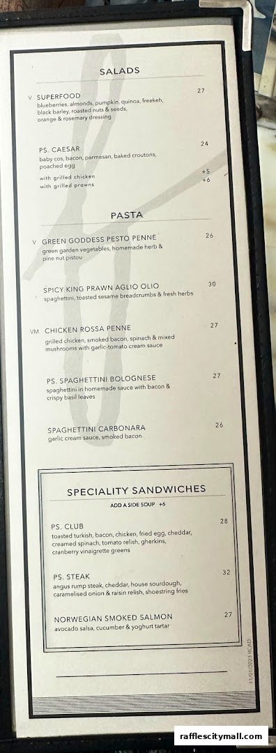 A menu from PS.Cafe Raffles City featuring salads, pasta, and sandwiches.