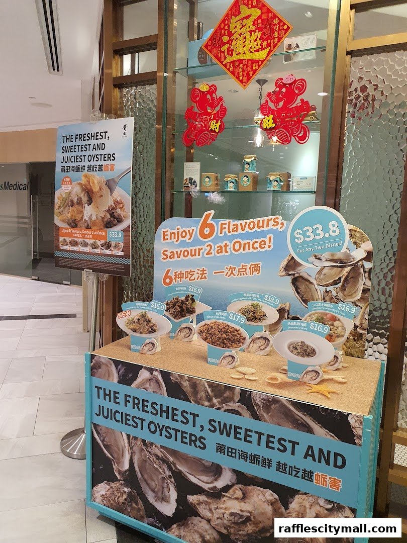 A display showcasing oysters and various oyster dishes with promotional signage.