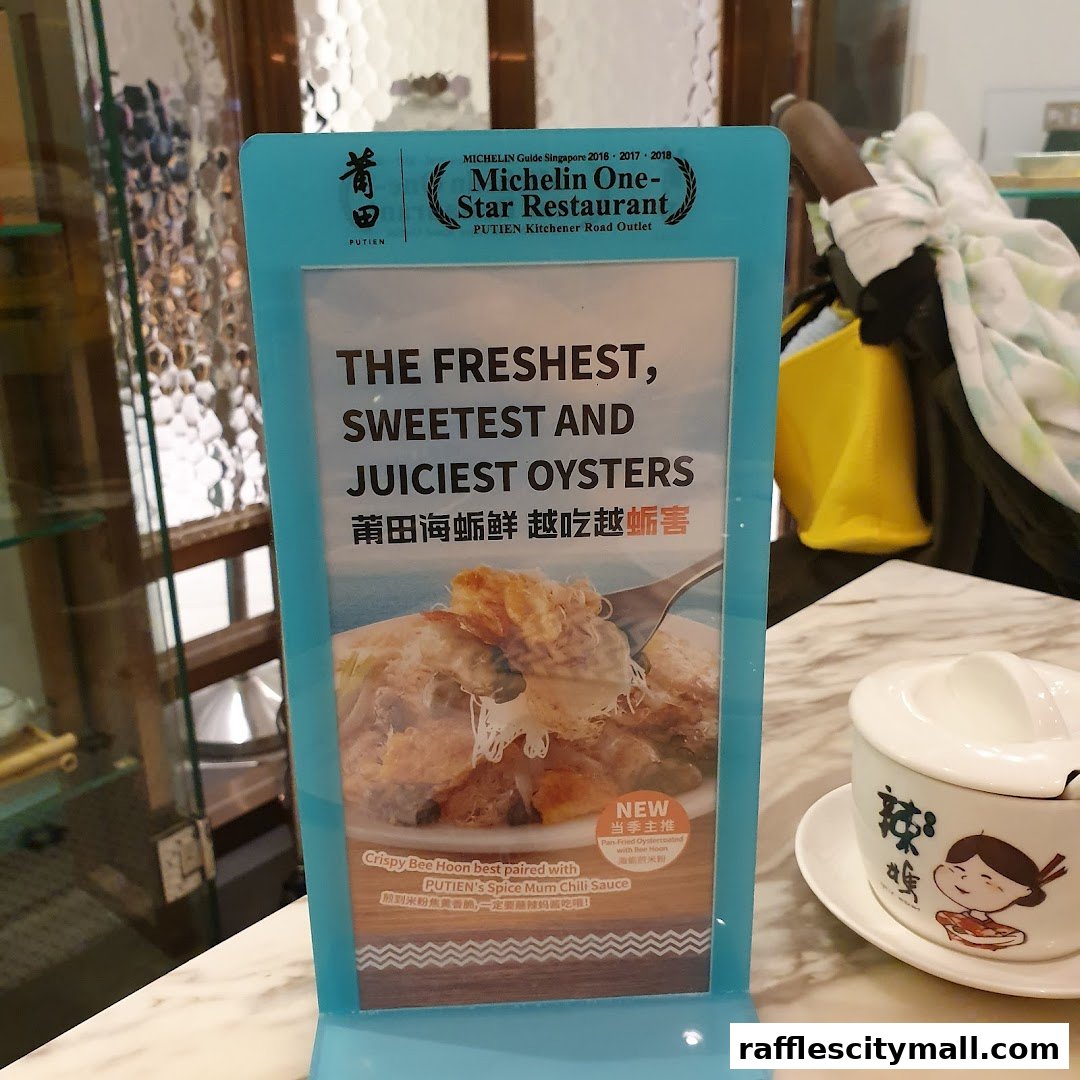 A sign advertising PUTIEN's Michelin One-Star Restaurant, highlighting oysters and crispy bee hoon.