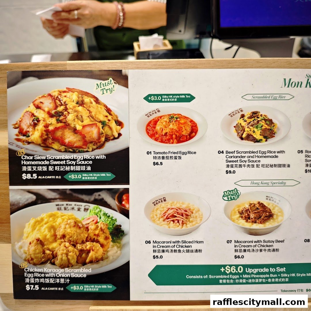 A menu display featuring various scrambled egg rice dishes and macaroni options.