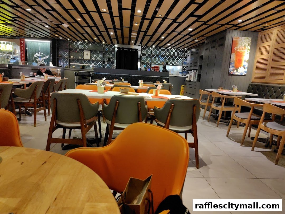 Interior view of a modern Thai restaurant with tables and chairs set for dining.