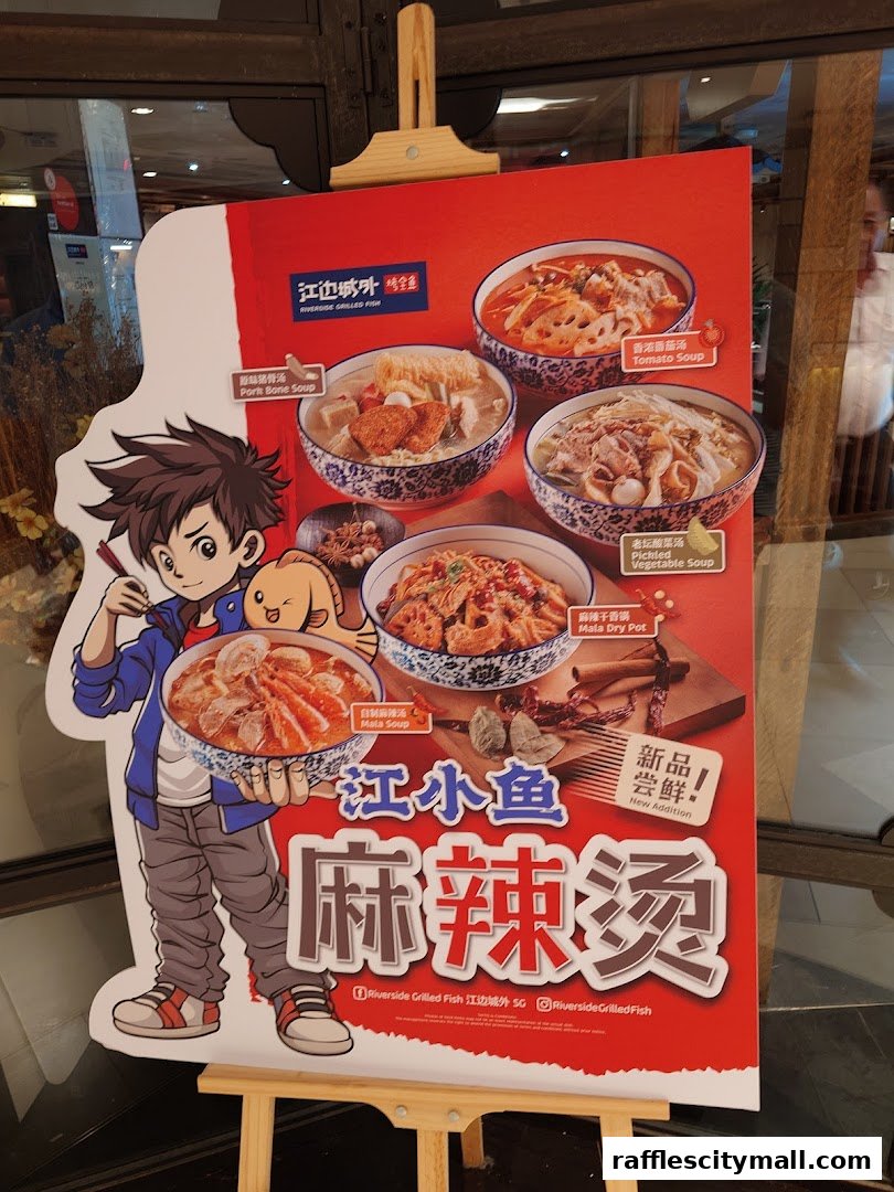 A promotional stand for Riverside Canton Claypot Cuisine featuring cartoon character and various claypot dishes.