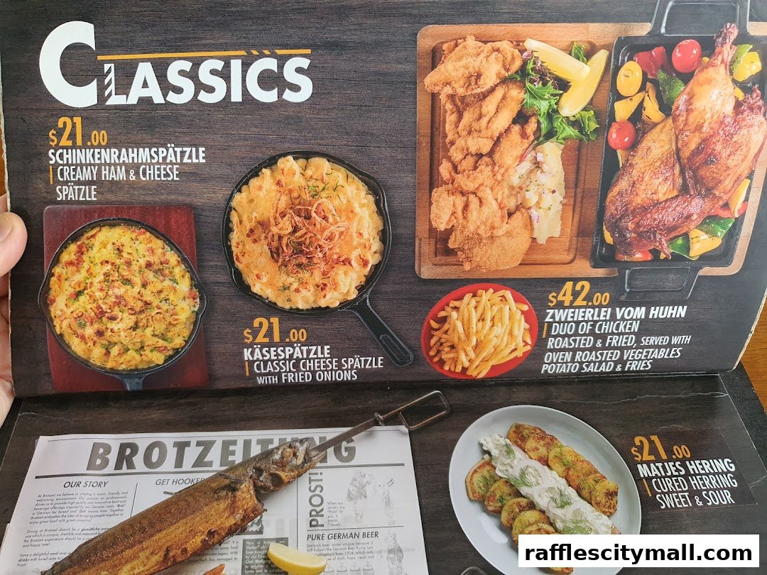 A menu showcasing German classics like Spätzle, roasted chicken, and cured herring.