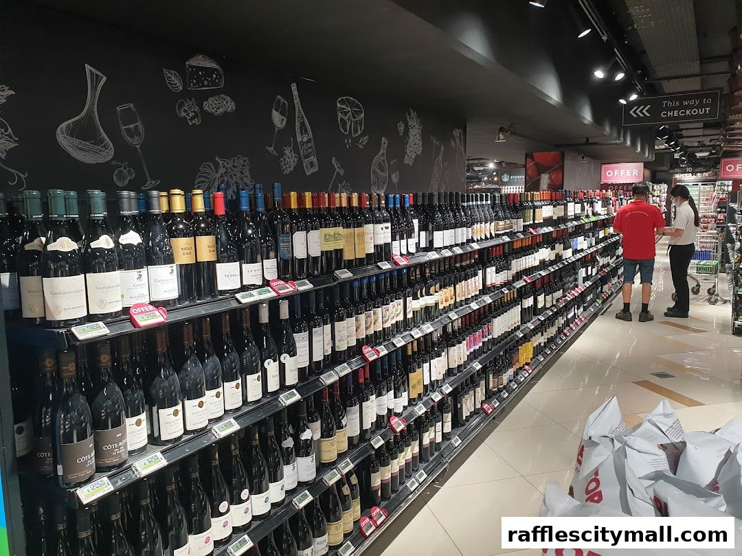 A wide selection of wine bottles displayed on shelves in a supermarket aisle.