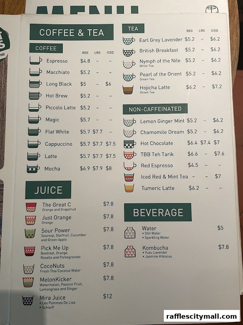 A menu from Tiong Bahru Bakery featuring coffee, tea, juice, and other beverages with prices.