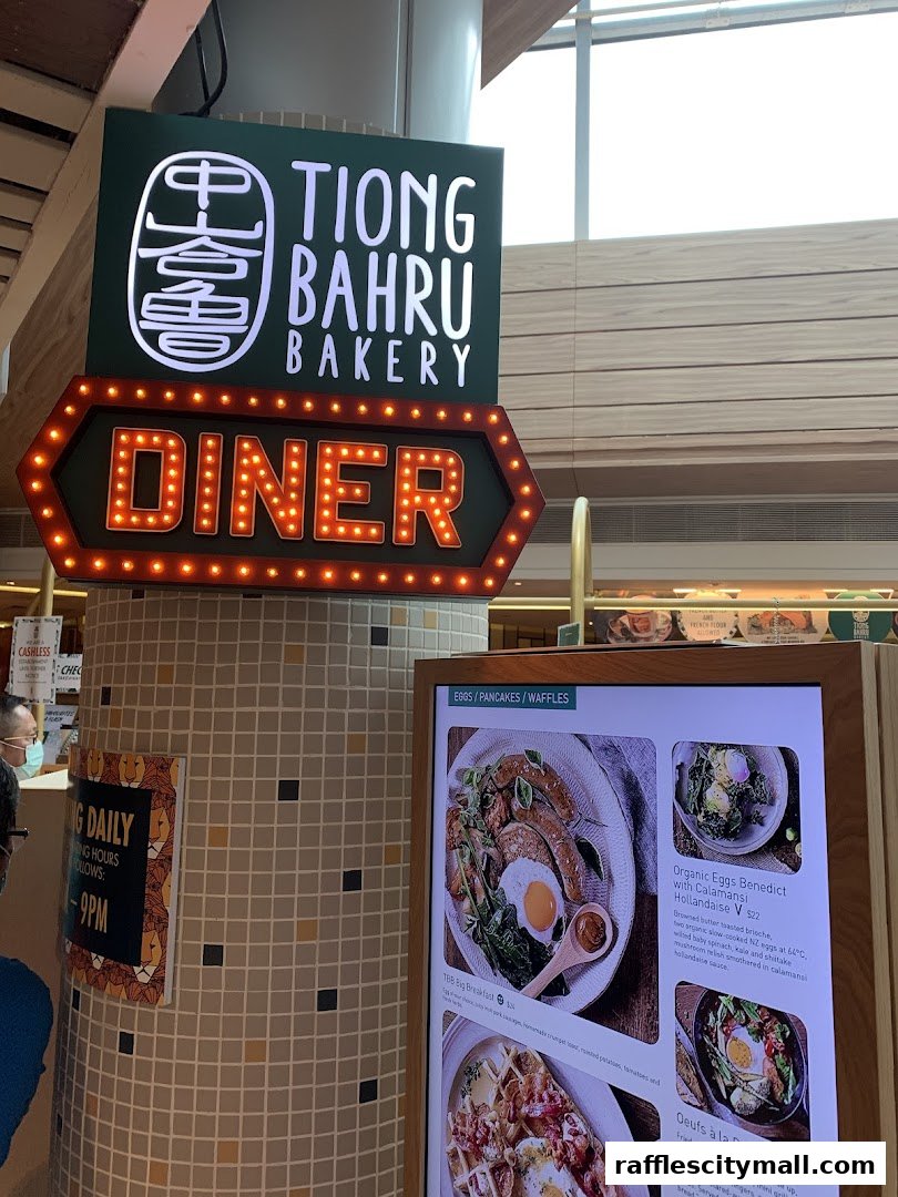 Tiong Bahru Bakery Diner sign with a digital menu displaying breakfast items.