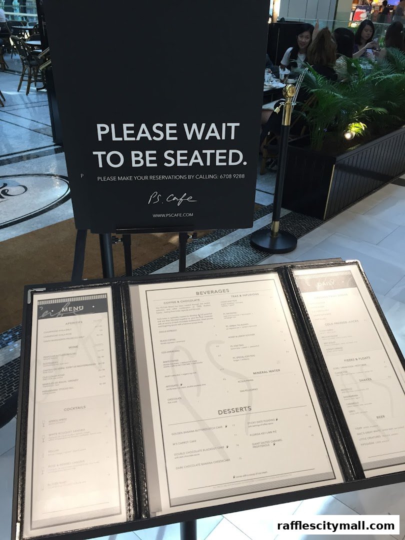 A menu for PS.Cafe with sections for appetizers, wine, cocktails, beverages, and desserts.