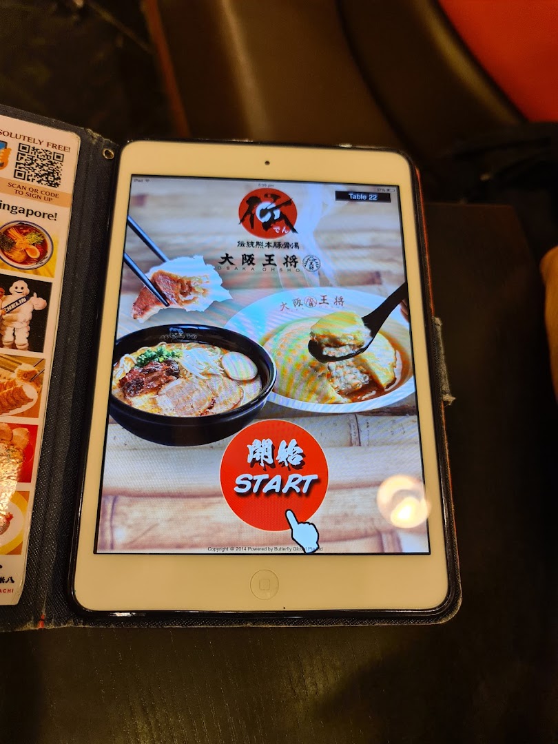 An iPad displaying the digital ordering interface for Osaka Ohsho, featuring ramen and other dishes.