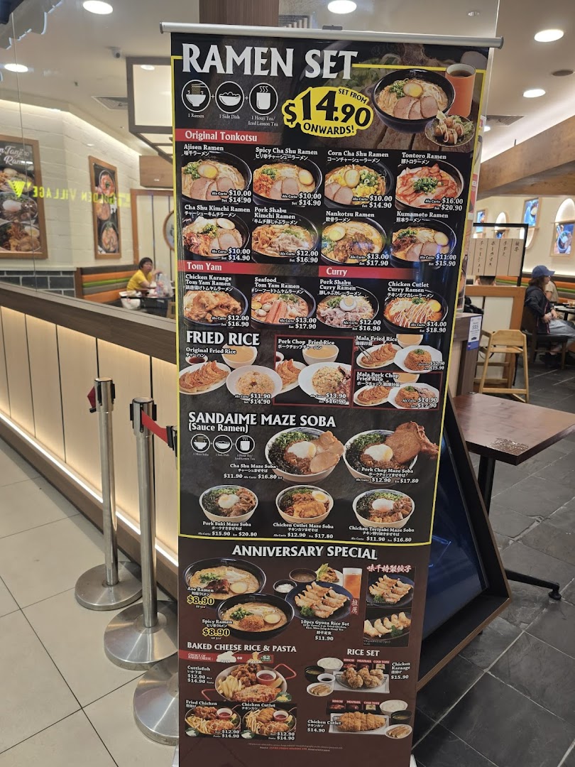 A vibrant menu board showcasing various ramen sets, fried rice, and other Japanese dishes.