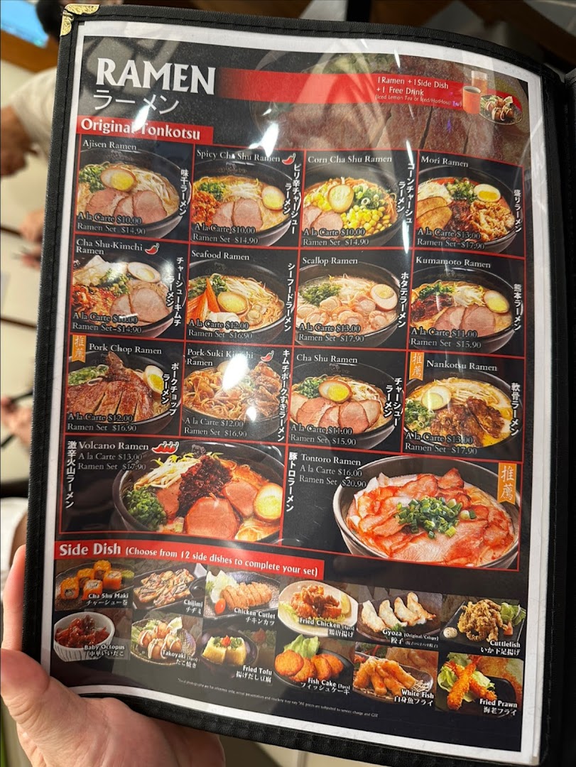 A detailed menu displaying various ramen dishes and side options from Ajisen Tanjiro.