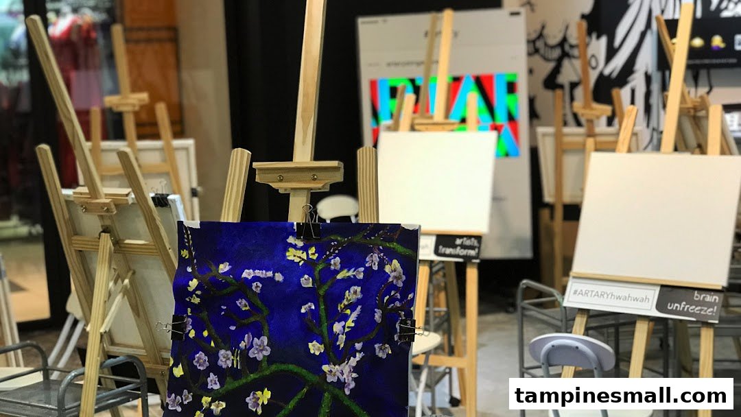 An art studio setup with multiple easels, blank canvases, and a vibrant painting.