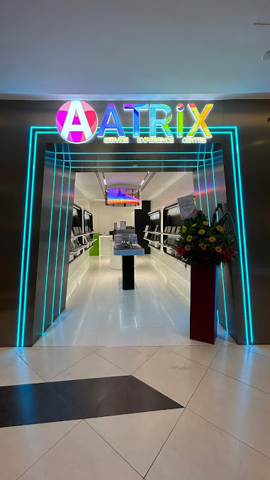 The brightly lit entrance of the ATRiX Official Store, showcasing its modern interior and service experience.