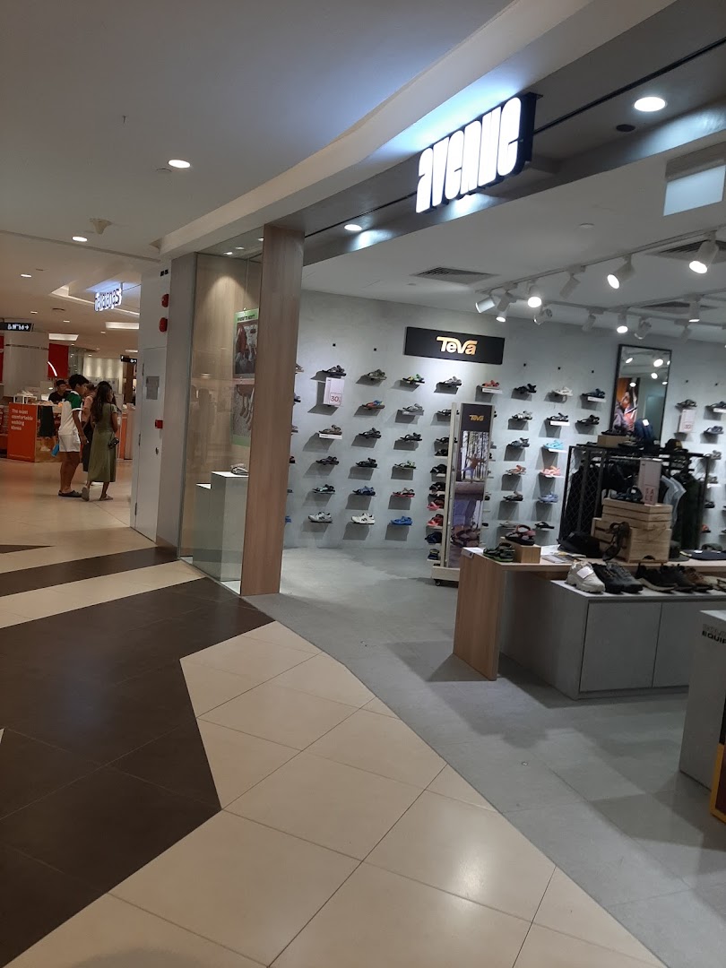 The entrance of Avenue Tampines Mall, showcasing a wide selection of footwear including Teva sandals.