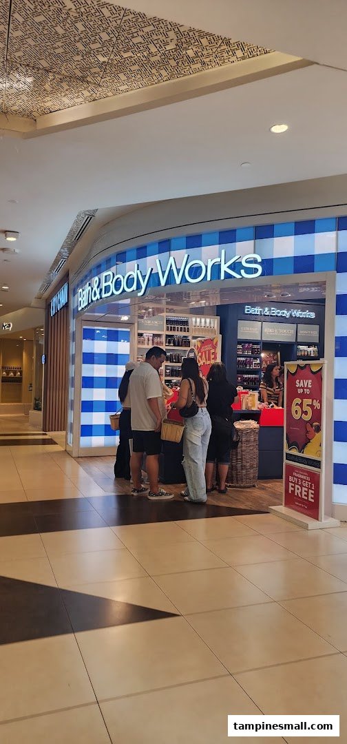 The vibrant storefront of Bath & Body Works at Tampines Mall, showcasing customers and prominent sale signage.