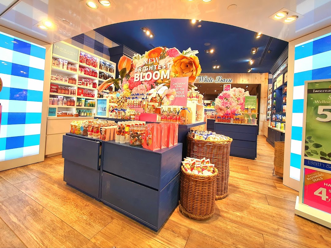Vibrant interior of Bath & Body Works showcasing an array of fragrances, body care, and home products.