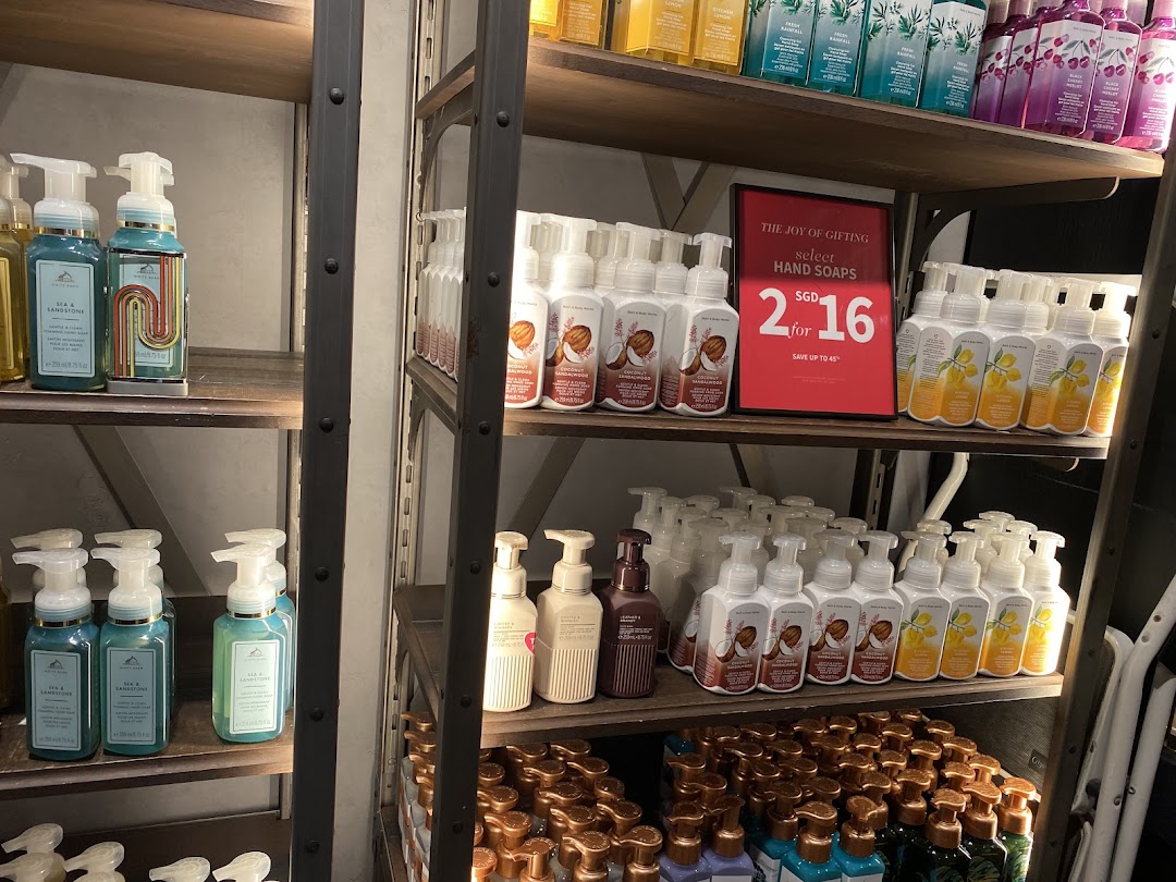 Shelves displaying a wide variety of Bath & Body Works hand soaps, featuring a '2 for SGD 16' promotion.