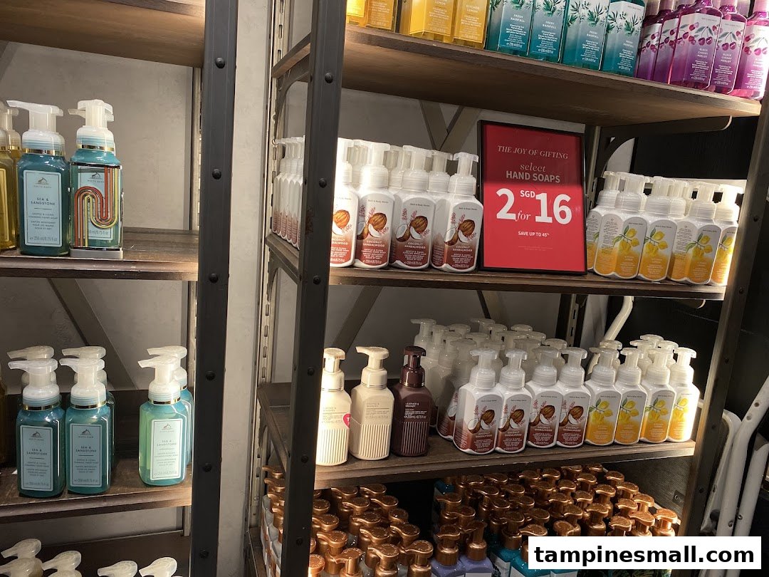 Shelves displaying a wide variety of Bath & Body Works hand soaps, featuring a '2 for SGD 16' promotion.