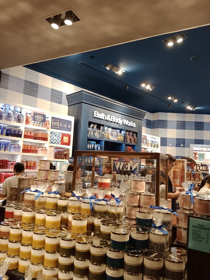 Interior view of Bath & Body Works, showcasing a large display of candles and various body care products.