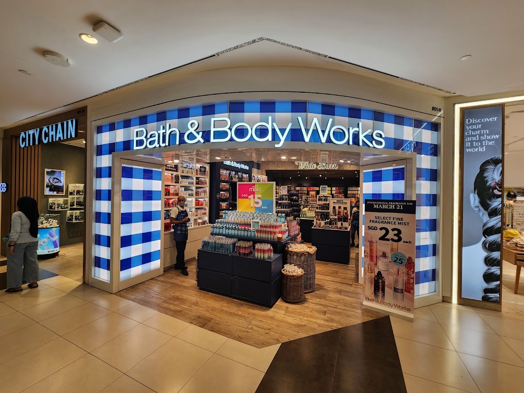 The vibrant blue and white checkered facade of Bath & Body Works at Tampines Mall.