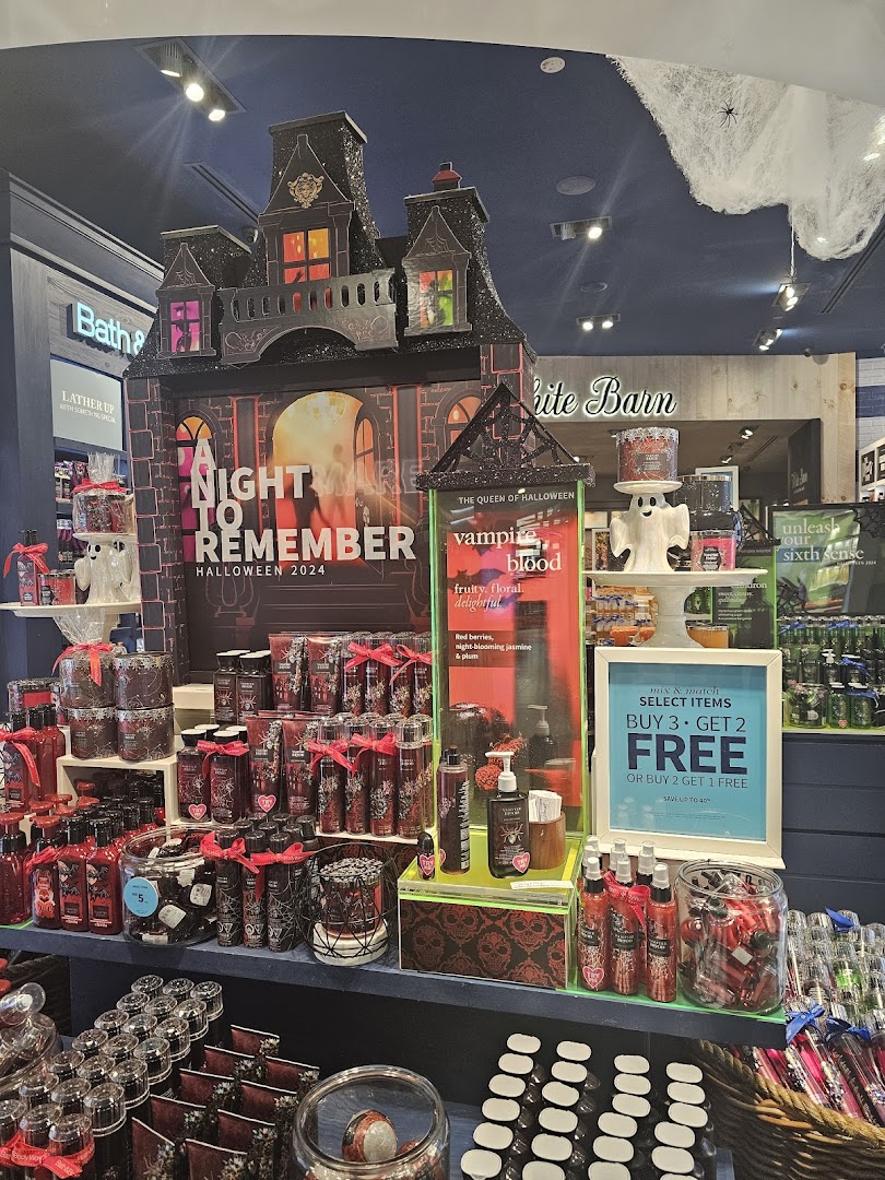 A vibrant Halloween 2024 display at Bath & Body Works featuring 'Vampire Blood' products and spooky decor.