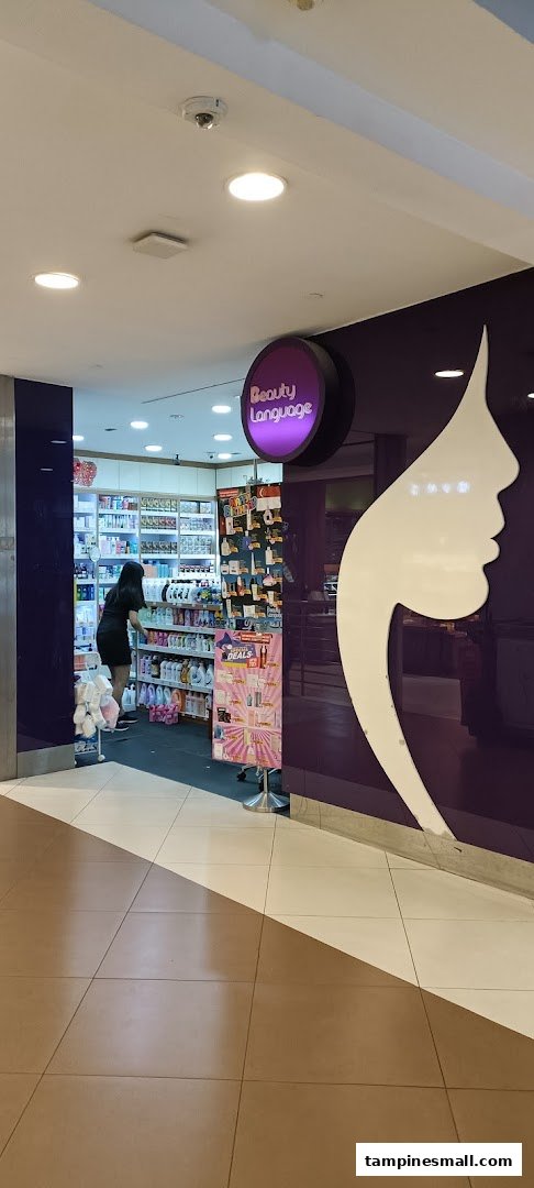 Entrance of Beauty Language shop with a customer browsing beauty products inside.