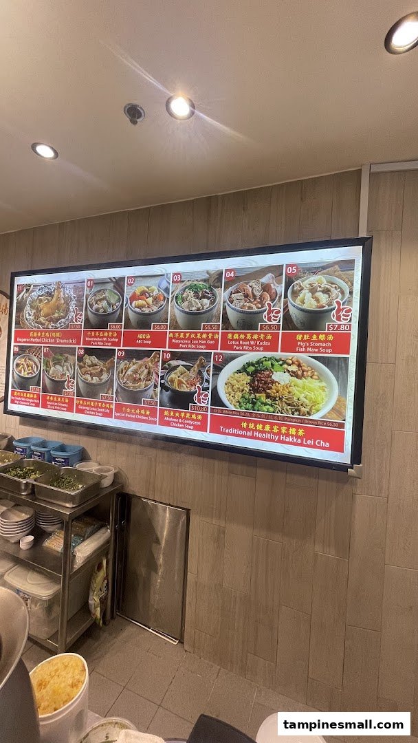 A digital menu board displaying various traditional Chinese soups and Hakka Lei Cha.