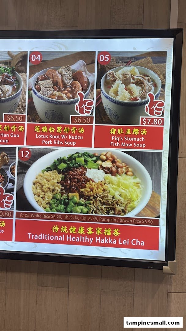 A digital menu board displaying various traditional Chinese soups and a Hakka Lei Cha dish.