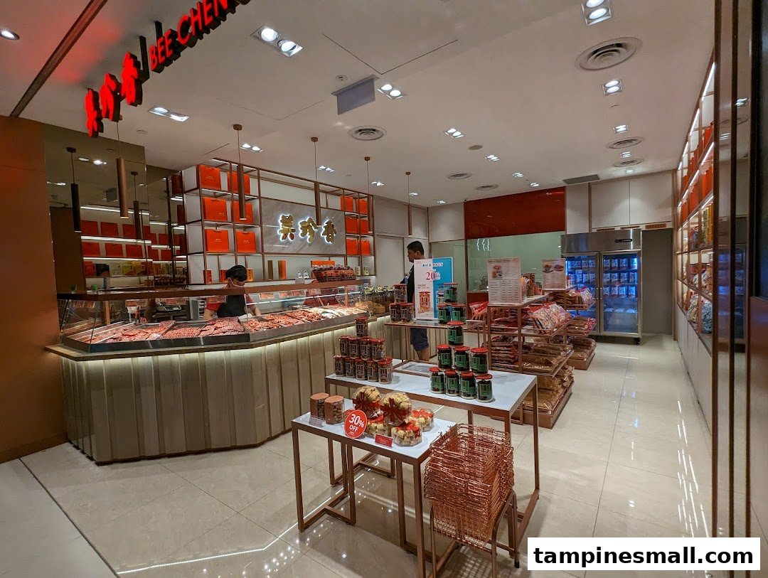 Interior view of Bee Cheng Hiang, showcasing their bak kwa display, packaged products, and staff.