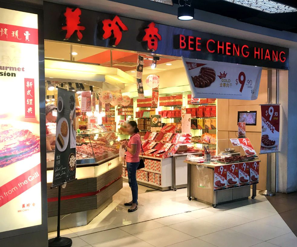 A vibrant shop front of Bee Cheng Hiang, showcasing bak kwa and other traditional Chinese delicacies.