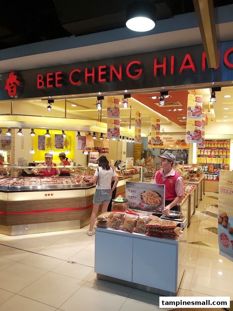 The Bee Cheng Hiang shop entrance features staff, customers, and a display of their famous bak kwa products.