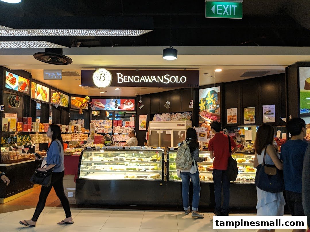 The shop front of Bengawan Solo, a bakery and cake shop, with customers browsing display cases.