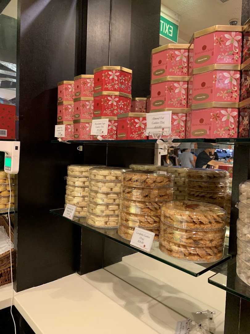 Shelves filled with beautifully packaged cookies and pastries, showcasing Bengawan Solo's delicious offerings.