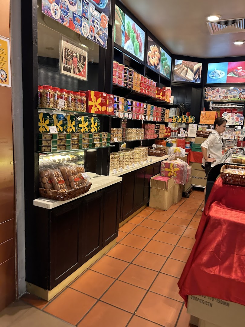 Interior view of Bengawan Solo, showcasing shelves packed with traditional Indonesian snacks and pastries.