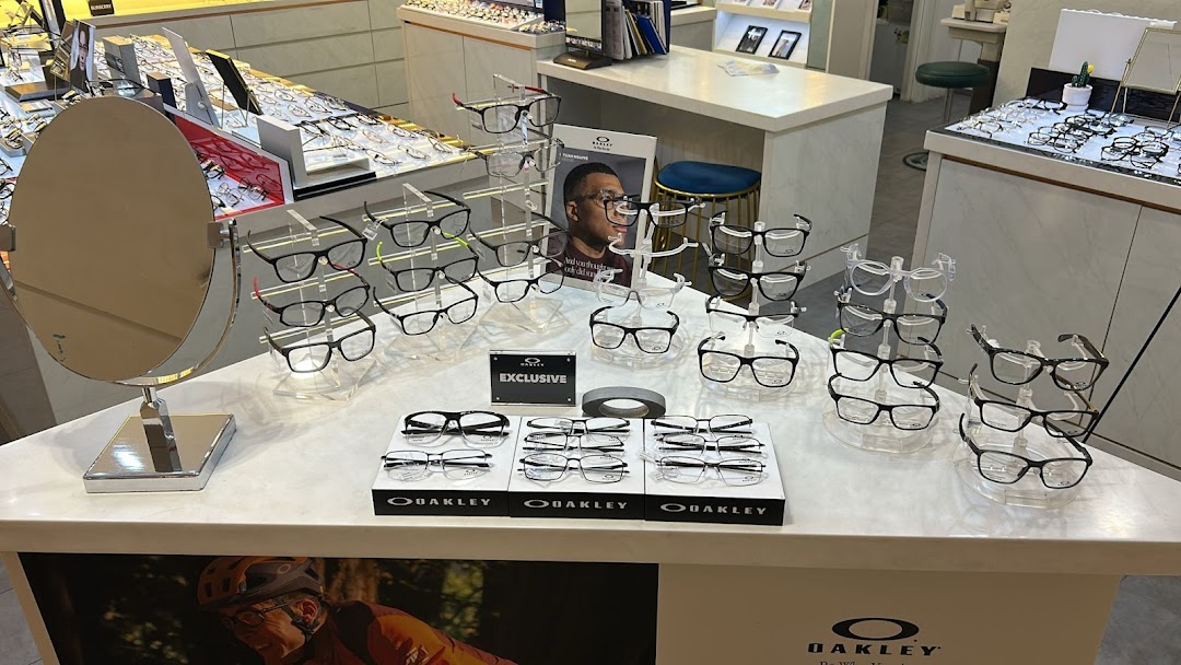 An interior view of Better Vision showcasing a wide selection of eyeglasses, including Oakley frames, on display.