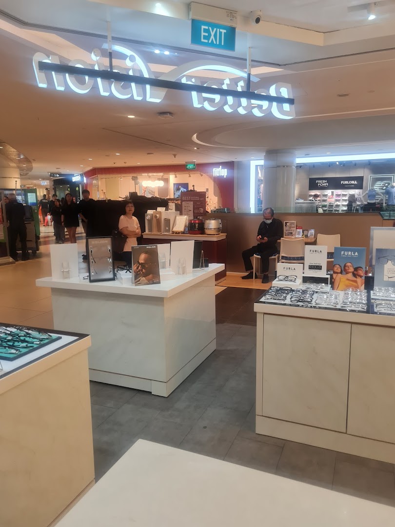 Interior view of Better Vision optical shop with eyewear displays and customers browsing.