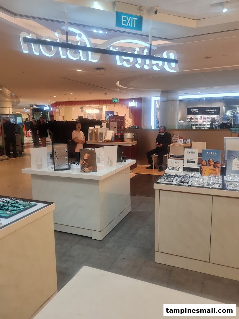 Interior view of Better Vision optical shop with eyewear displays and customers browsing.