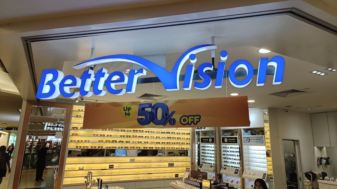 The storefront of Better Vision optical shop, featuring its prominent blue signage and a 'Up to 50% OFF' promotion.