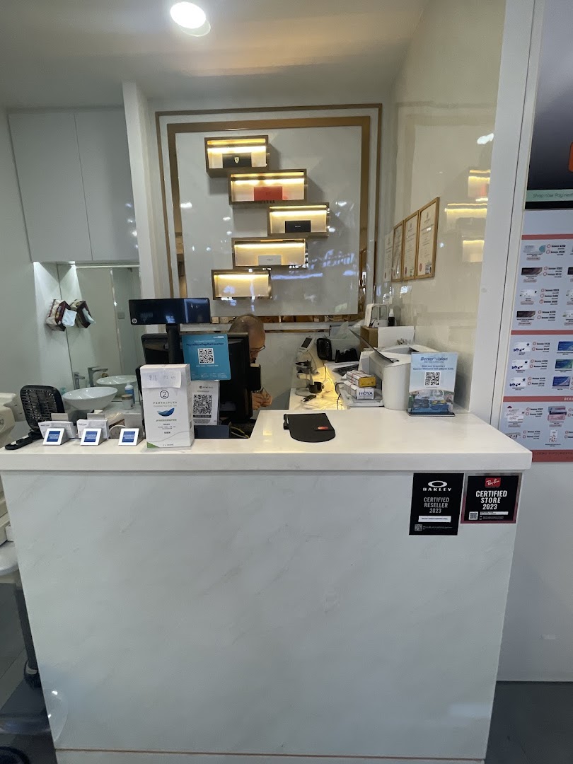 An interior shot of Better Vision's modern counter area with product displays and service desk.